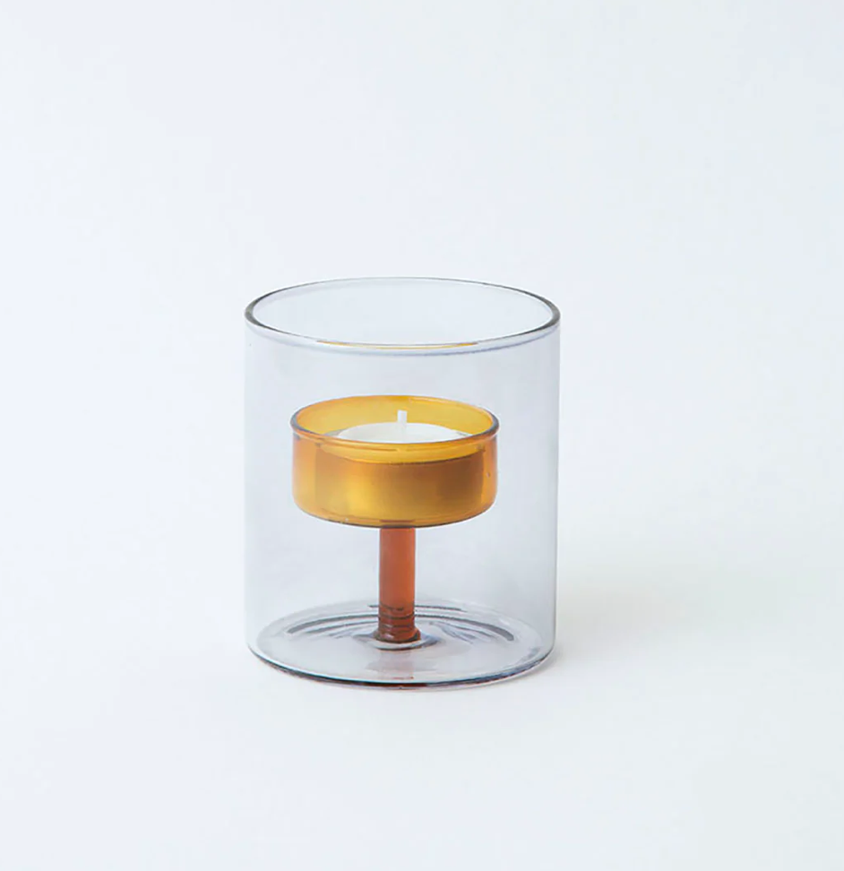 Clear glass cylindrical tea light holder with grey exterior & orange interior  candle holder