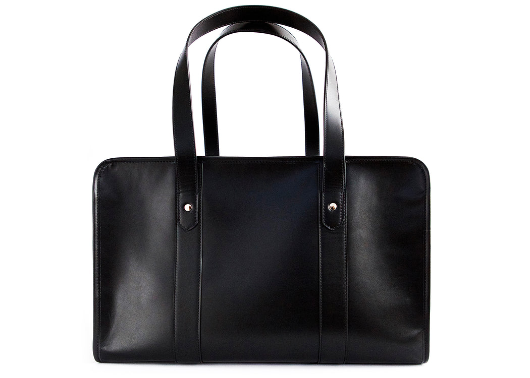 Black leather travel bag with shoulder straps