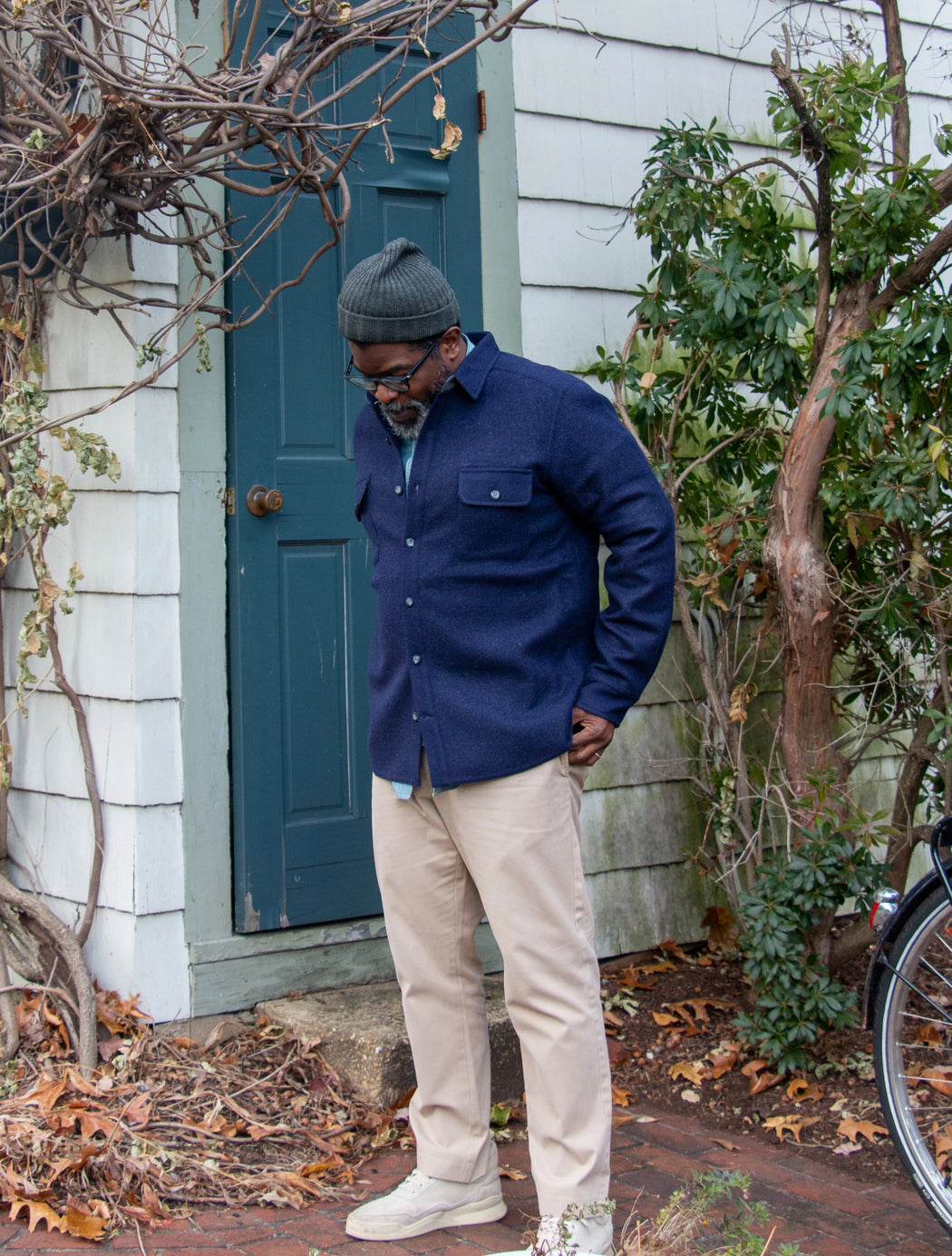 Man wearing dark blue utilitarian CPO over shirt