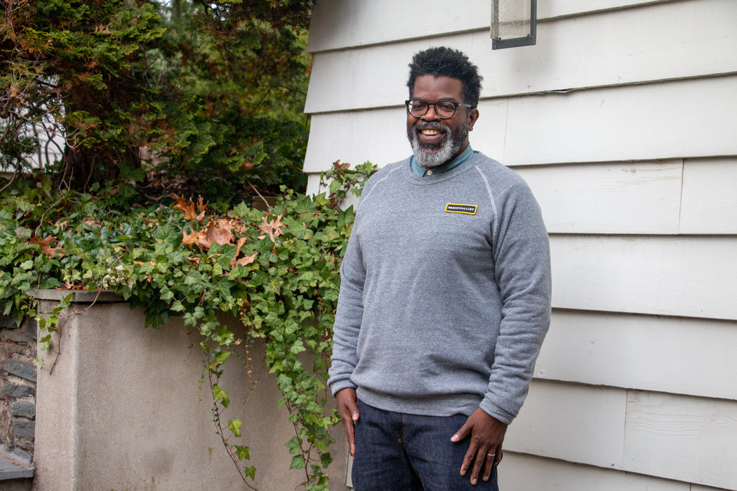 Male model wearing grey long sleeve Semifinalist Team Sweatshirt