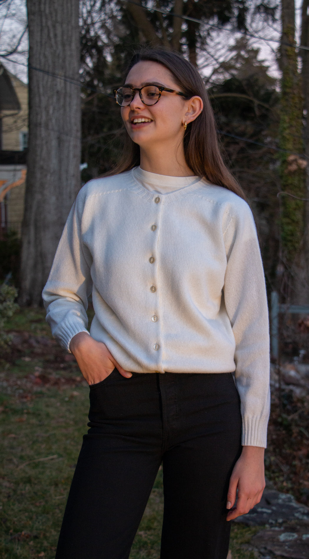 Girl wearing white long sleeve cardigan sweater