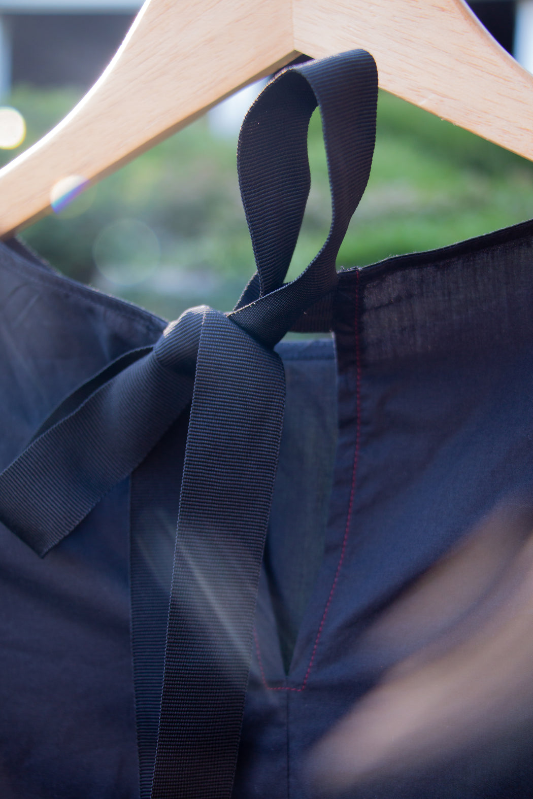 Black ribbon tie back closure