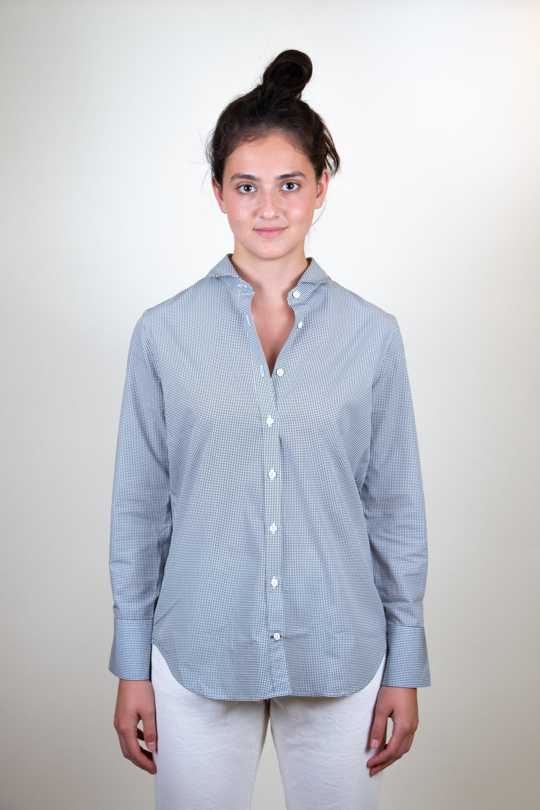 Model wearing Semifinalist black mini dot print on silky white poplin with a Peter Pan collar