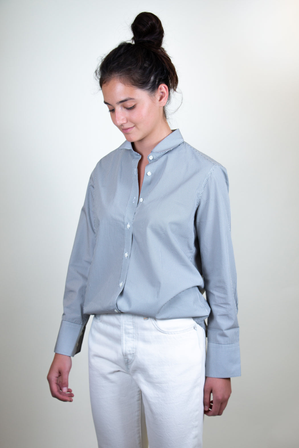 Model wearing Semifinalist's black mini dot print on silky white poplin with a Peter Pan collar