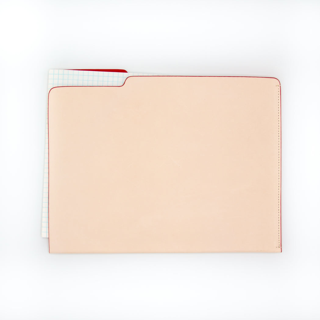tan and red leather file folder with notepad inside