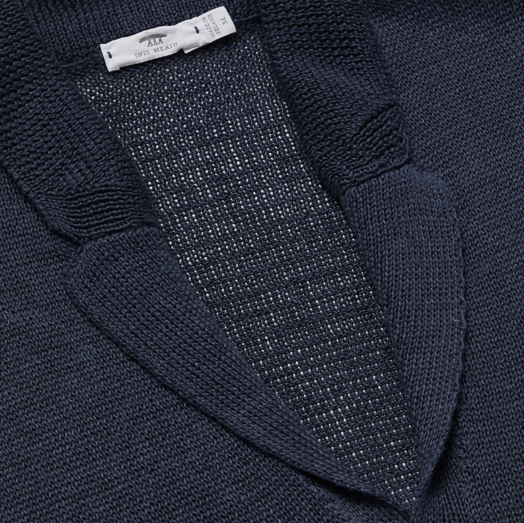 Close-up on dark grey knit cardigan lapel