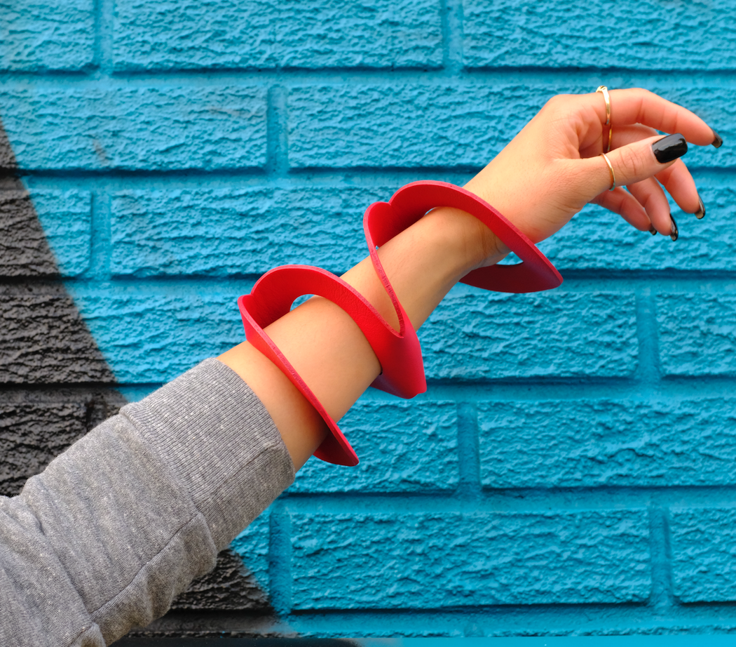 Red leather bracelet worn on model's arm