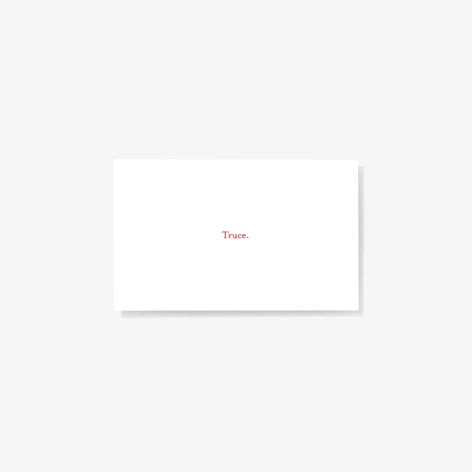 White note card reading "Truce."