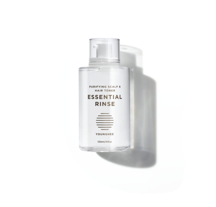 Clear bottle of hair care product: "Essential Rinse by Younghee"