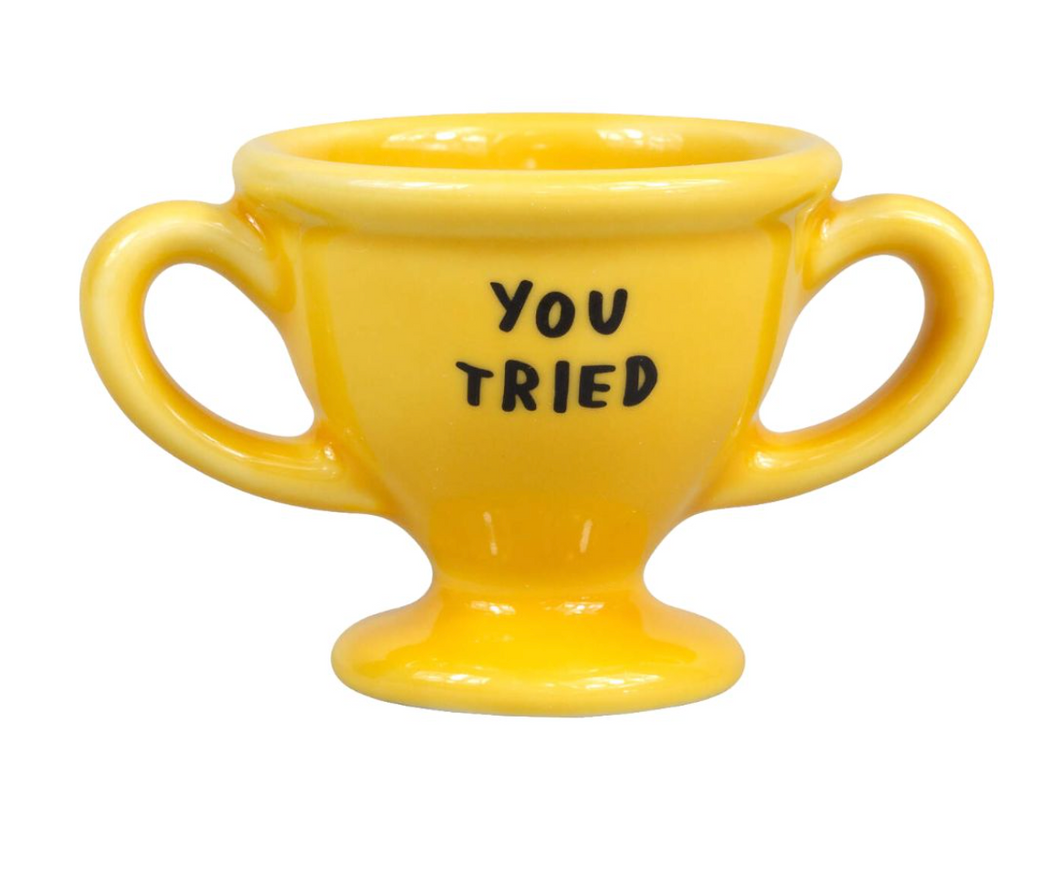 Yellow double-handled ceramic egg cup reading "You Tried" in black