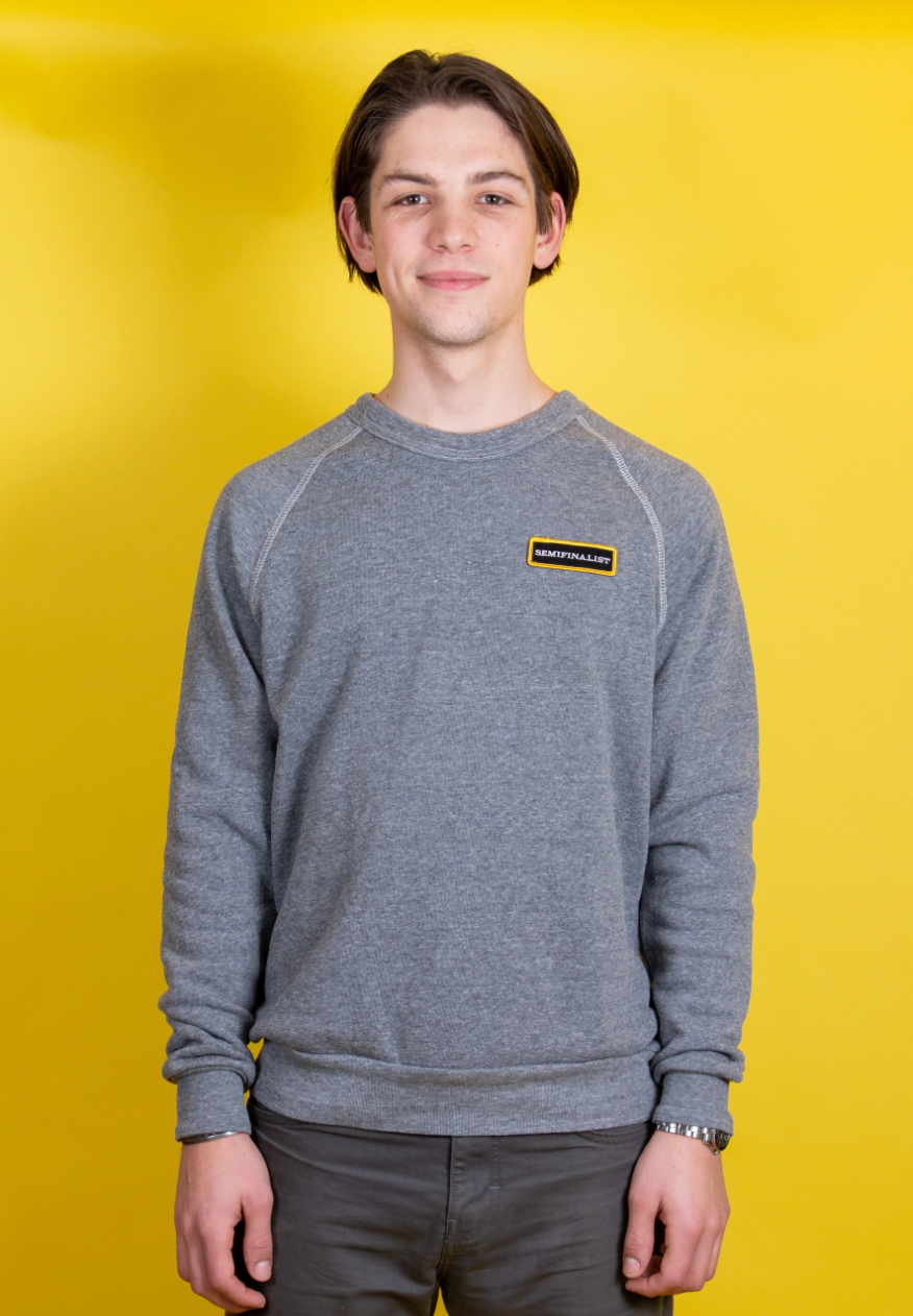 Male model wearing grey long sleeve Semifinalist Team Sweatshirt