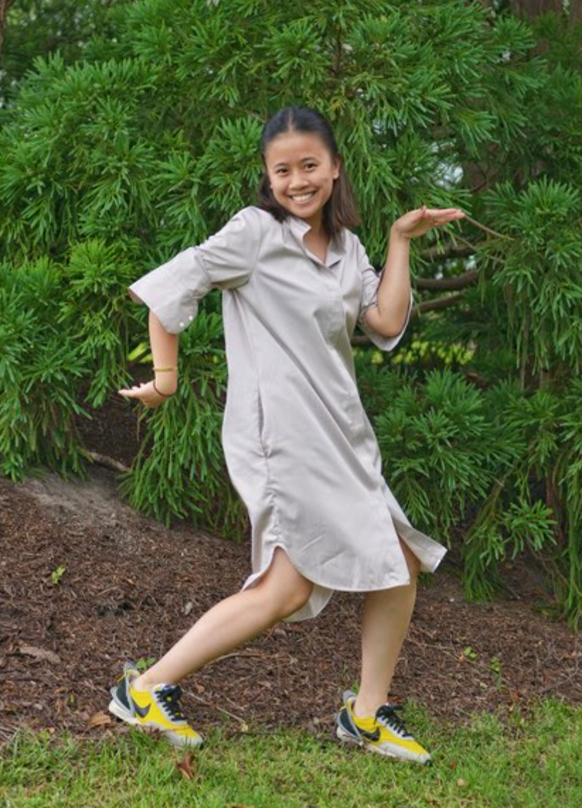 Female model wearing tan stripe long sleeve shirtdress