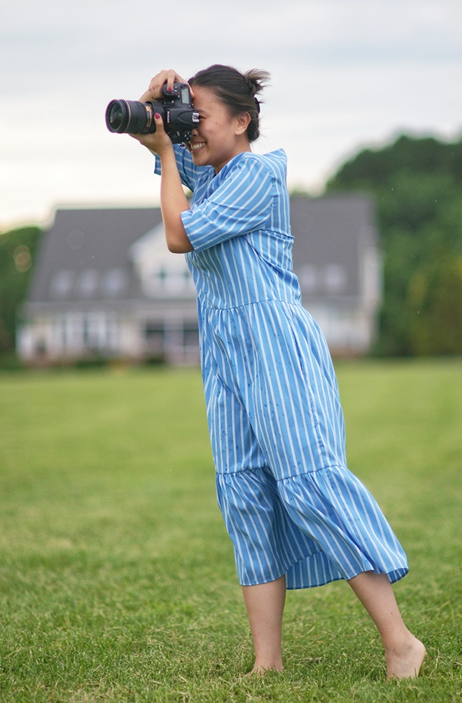 Girl wearing blue & white striped short sleeve petticoat dress