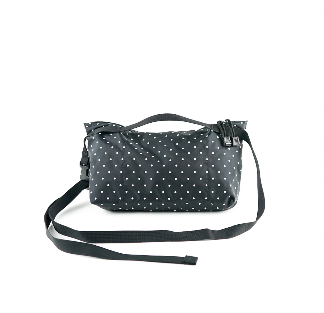 Back view: Black and white dot nylon fanny pack with zip closure and adjustable black strap