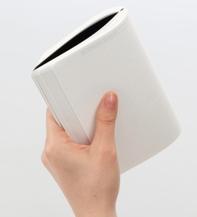 hand holding notebook