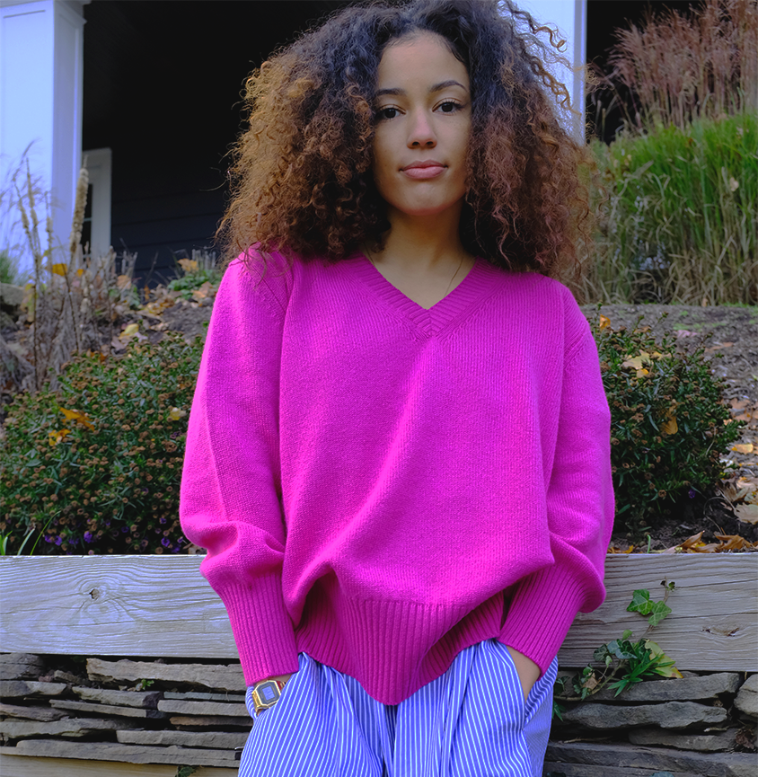 Model wearing hot pink v-neck sweater