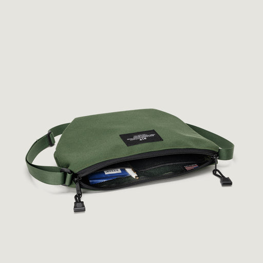 Olive green small nylon canvas tote with zip closure & adjustable shoulder strap & interior pockets