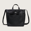 Black canvas tote with 4 exterior pockets, snap closure, handles & shoulder strap, front view