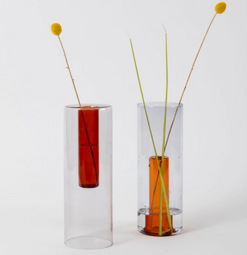 Clear glass cylindrical vase with grey outer vessel & small orange inner vessel