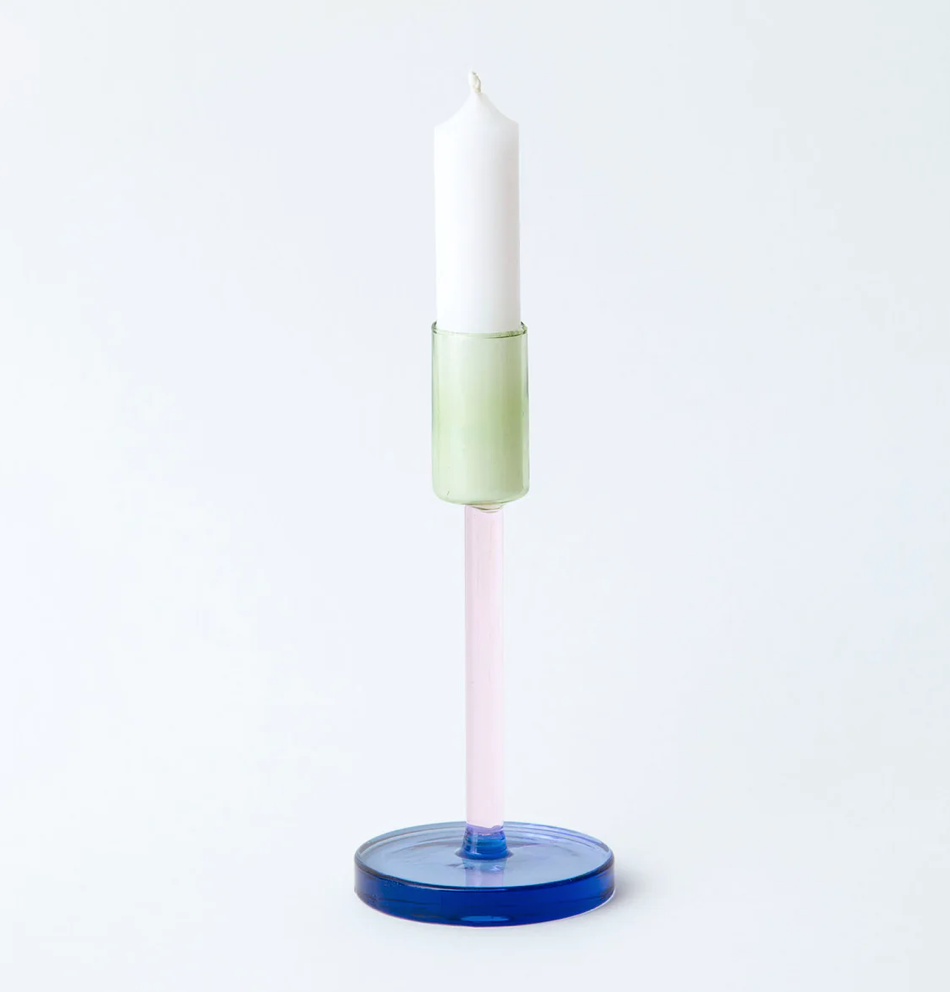 Pink & green glass candlestick holder with blue base and white candle