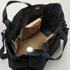 Interior view: Large black tote bag with snap closure, khaki interior organization pockets, black handles & shoulder strap