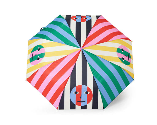 Top view: multi-color striped umbrella with 4 smiley face graphics around the edges
