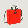 Reddish-orange tote bag with exterior pockets, olive green handles & shoulder strap, and  snap closure