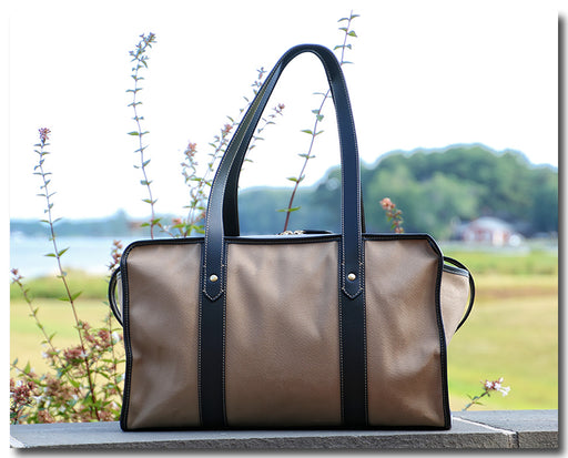 Tan cotton twill weekender bag with leather handles