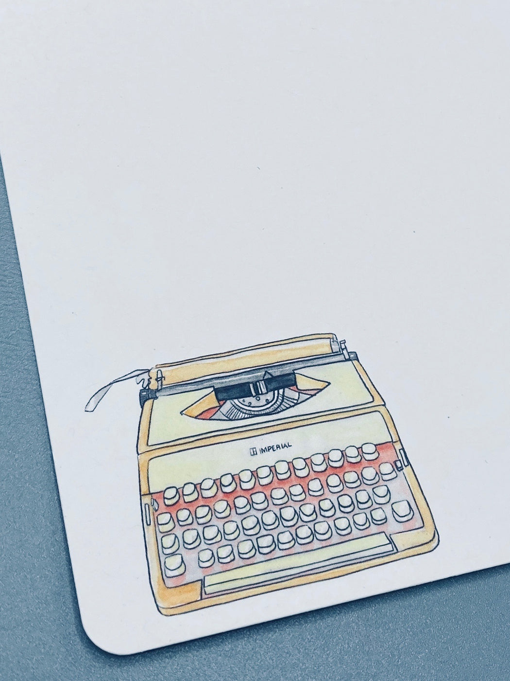 Notecard illustration of a yellow typewriter