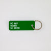 Green rectangular key tag reading "NO NAY NEVER NO MORE" in white print