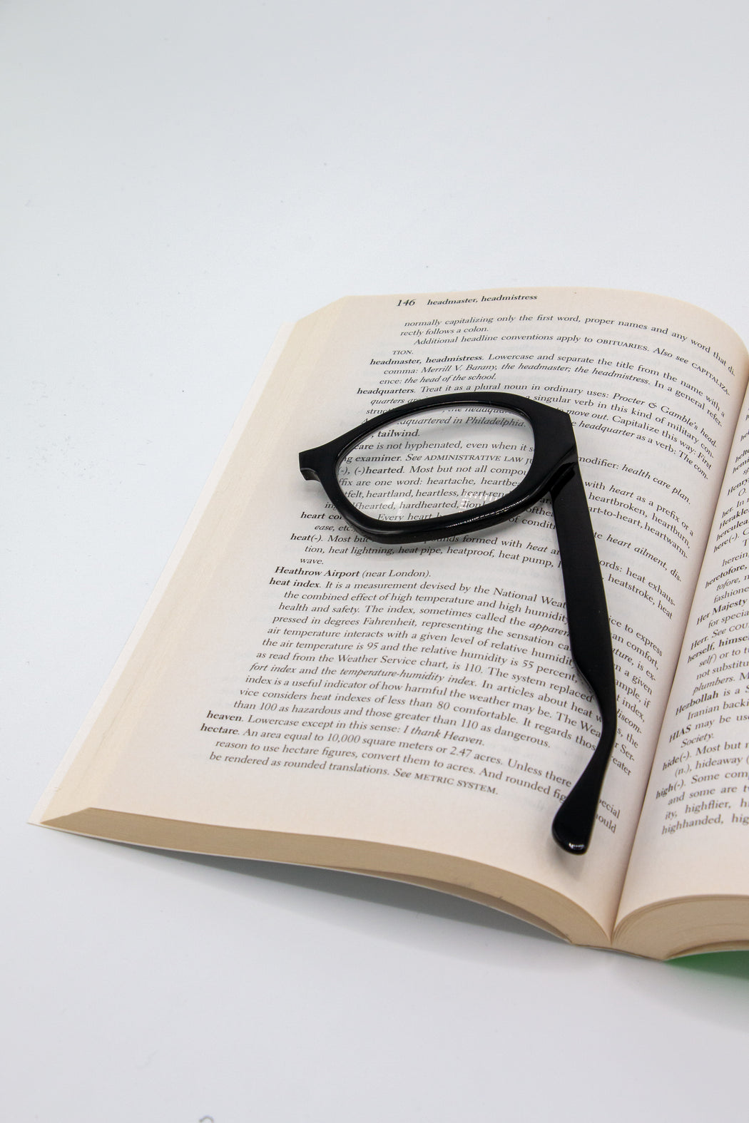 Black Monocle Magnifying Glass on book