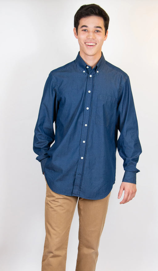Model wearing Indigo denim shirt with long sleeves and white buttons