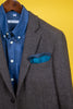 Blue cotton and linen square scarf inside jacket pocket