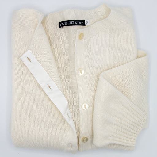 White cardigan sweater, folded