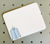 White note card with illustration of a striped shirt on bottom left corner 