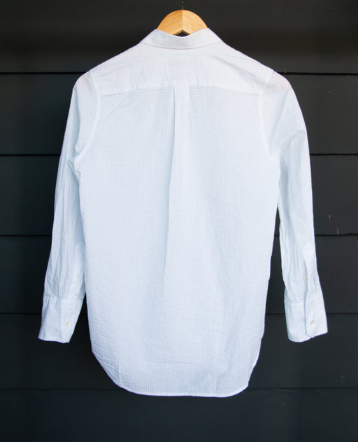 Back view: White crinkle cotton shirt with Peter Pan collar on hanger
