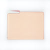 tan and red leather file folder with notepad inside 