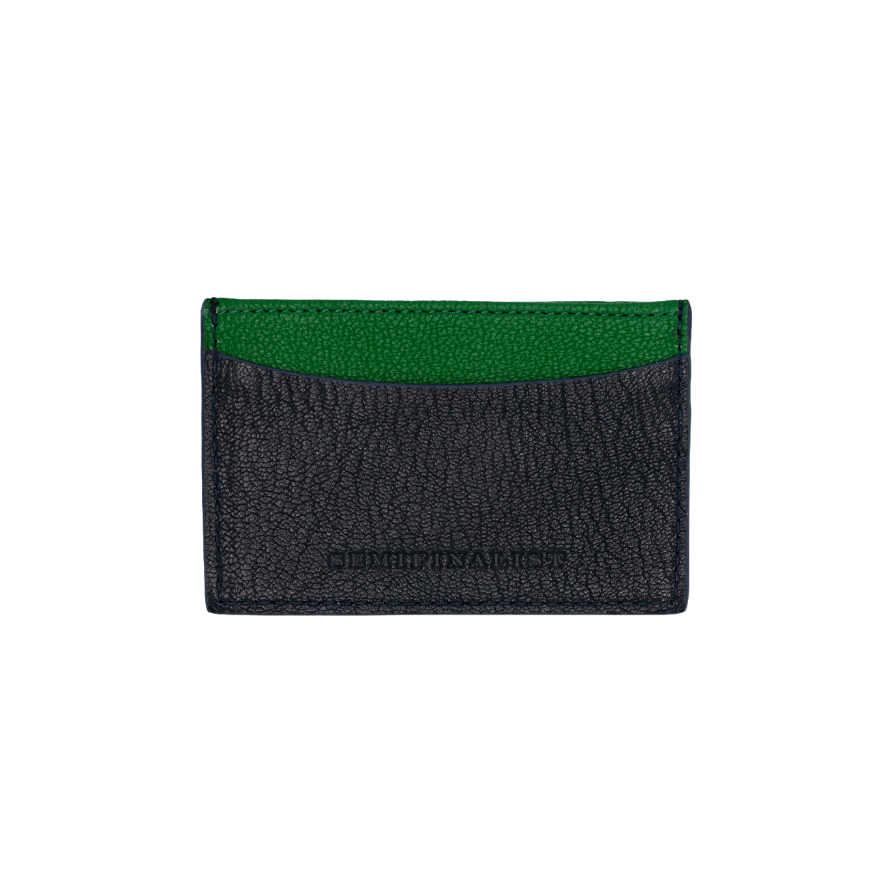 Navy leather card case with one green pocket
