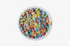 A completed jigsaw puzzle of a colorful bowl of cereal