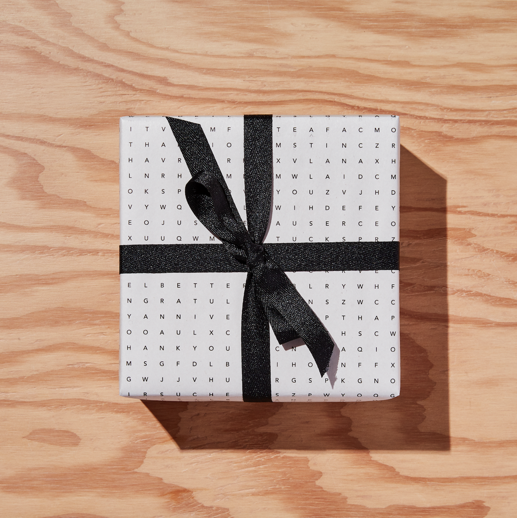 Black & white Word Search gift wrapped box with black ribbon