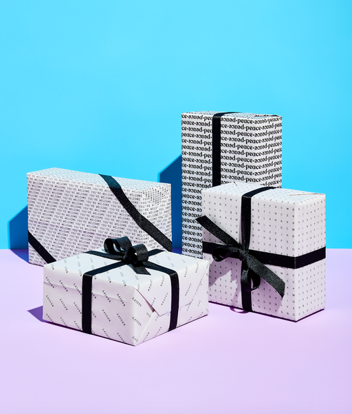 4 boxes wrapped in black & white All Occasion Gift Wrap and black ribbons