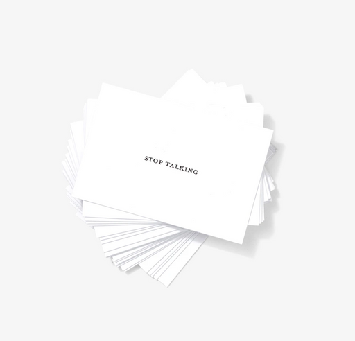 Fanned out stack of white business cards reading "Stop Talking"