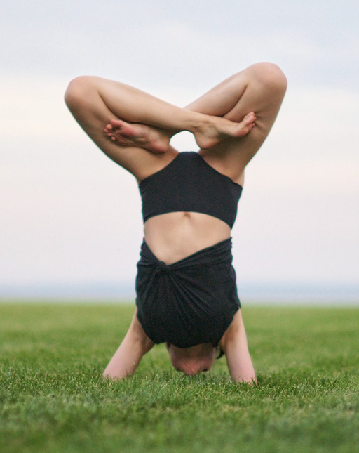 Girl in yoga pose wearing black high waist women's underwear