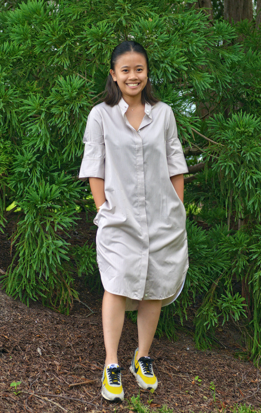Female model wearing tan stripe long sleeve shirtdress 