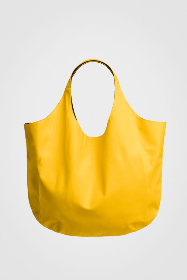 Yellow u-shaped bag with rounded handle