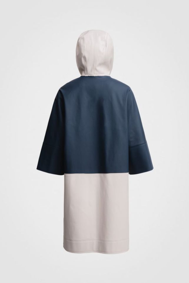 Back view: White hooded raincoat with navy back panel & sleeves