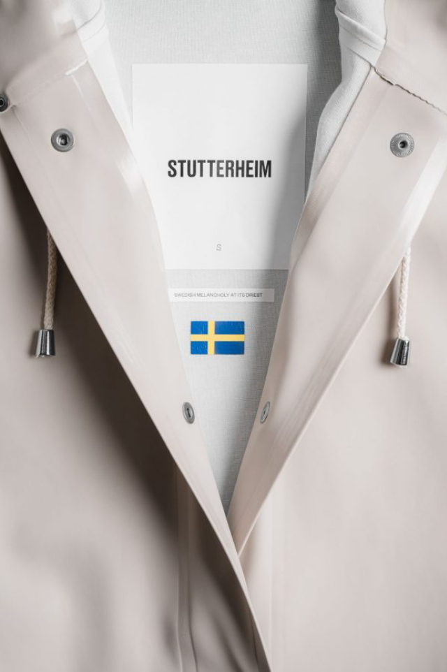 Close-up of raincoat collar showing the Stutterheim label and Swedish flag