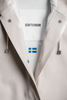 Close-up of raincoat collar showing the Stutterheim label and Swedish flag