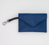Blue leather card case with v-shape flap and navy clip strap