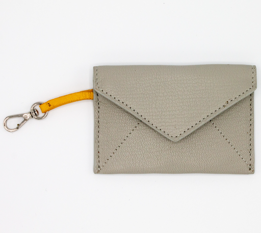 Grey leather card case with v-shape flap and yellow clip strap
